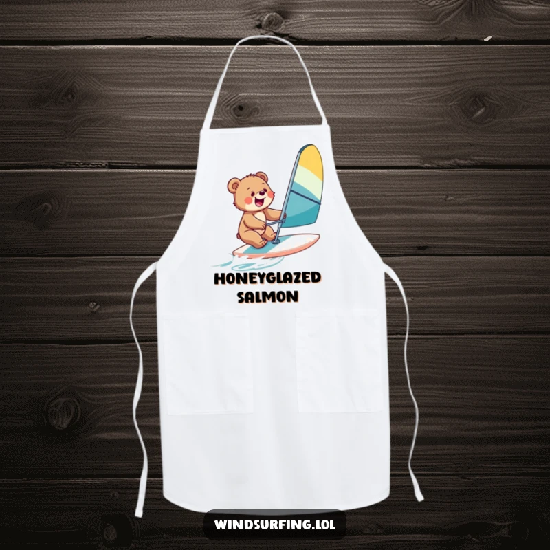 Funny apron with a bear cub windsurfing, perfect for kitchen adventures and bringing a sense of outdoor fun indoors.