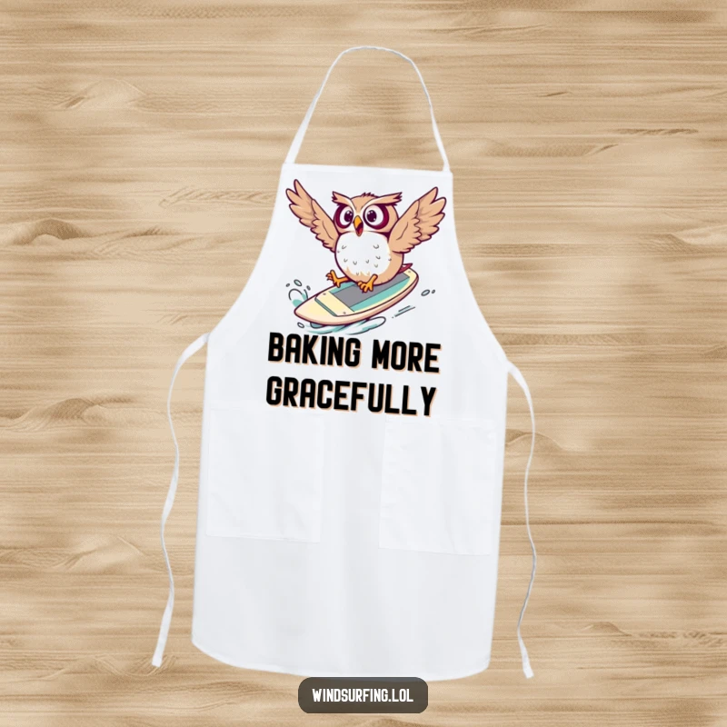 Funny Apron depicting a surprised owl comically falling off a windsurf board, ready for kitchen chaos.