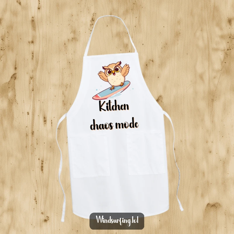 Funny owl apron showing a surprised owl falling off a windsurf board, a comical kitchen accessory for home chefs.