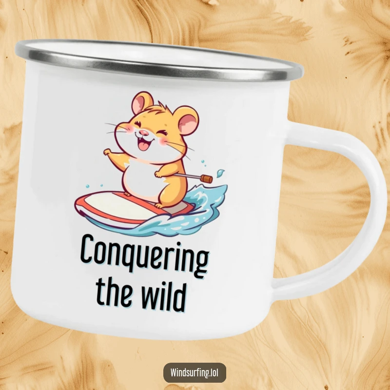 Funny camping mug with a cheerful hamster grinning while steering a windsurf board, with a scenic background.