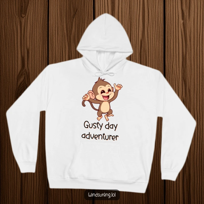 Funny hoodie depicting a mischievous monkey playfully leaning into a strong gust of wind, embodying cheeky fun.