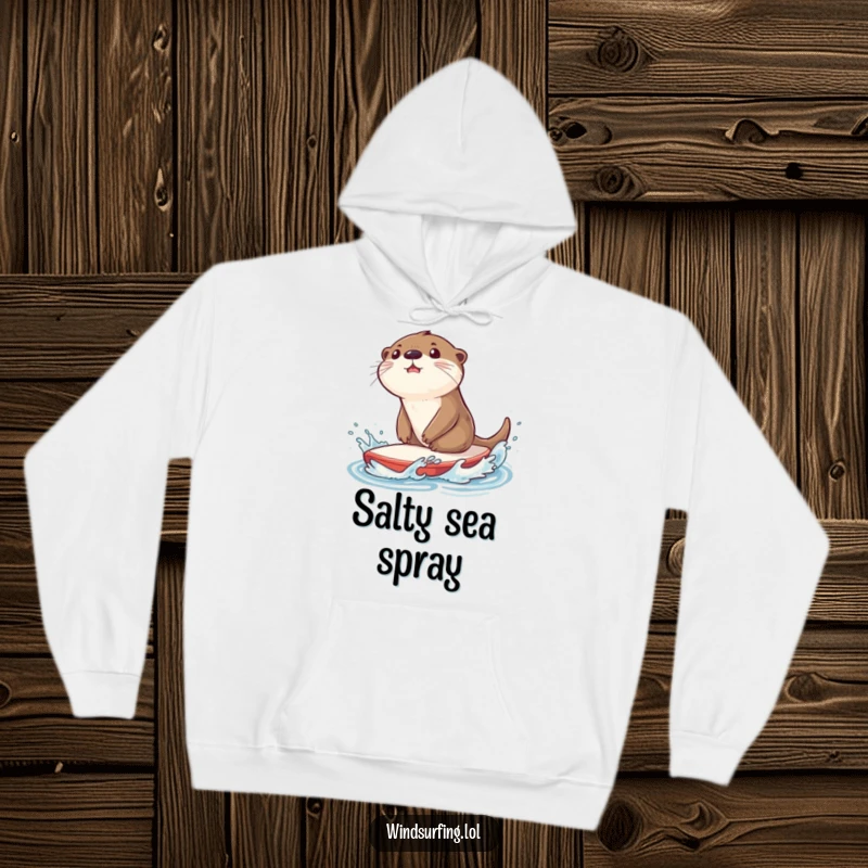 Funny hoodie featuring a surprised otter splashing water while riding a sailboard, perfect for staying warm with a touch of watery excitement.